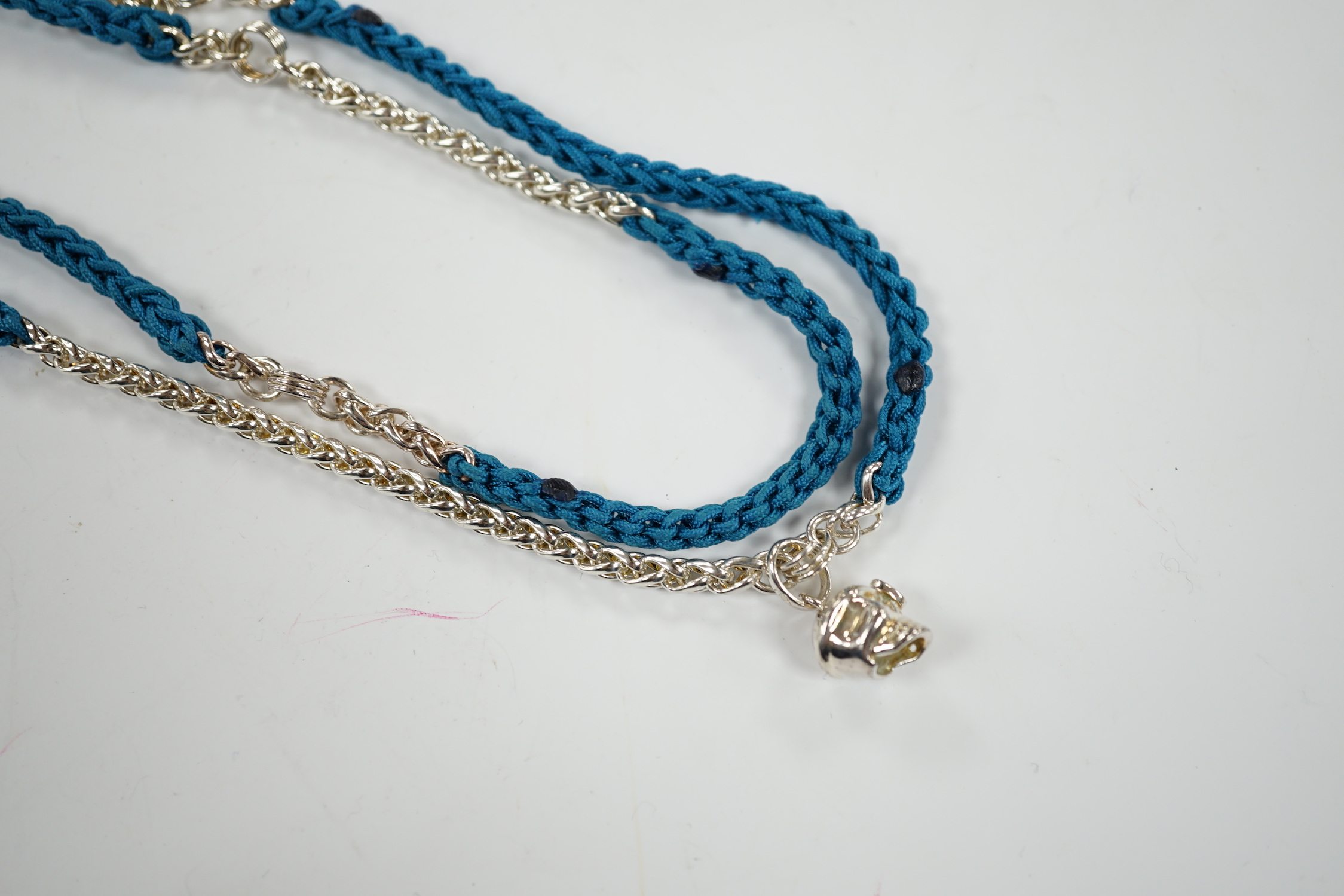 A modern Links of London, silver skull and heart pendant, 14mm, on a Links of London, silver link and rope twist thread chain, 90cm, in a Links of London box.
